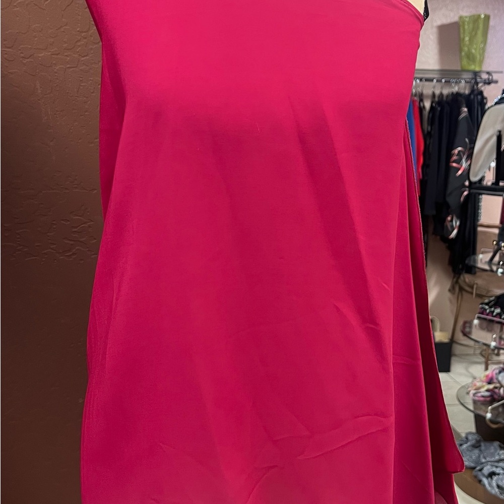 Asymmetrical silk top/camisole with cross strap back.